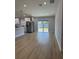 Open concept living and kitchen area with sliders to backyard at 468 Marion Oaks Blvd, Ocala, FL 34473