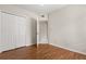 Bedroom with open closet doors at 527 Villa Del Sol Cir # 104, Orlando, FL 32824
