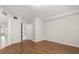 An inviting bedroom with hardwood floors and neutral paint, ready for personalization at 527 Villa Del Sol Cir # 104, Orlando, FL 32824