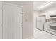 Well-lit kitchen with white cabinets and appliances, conveniently located near the entrance at 527 Villa Del Sol Cir # 104, Orlando, FL 32824