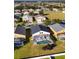 Charming aerial view showcasing homes with screened-in pools in a quiet neighborhood at 558 Cadiz Loop, Davenport, FL 33837