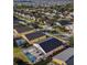 Stunning aerial view of homes with screened-in pools nestled in a suburban neighborhood at 558 Cadiz Loop, Davenport, FL 33837