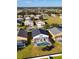 A beautiful aerial view showcasing the home's screened-in pool and backyard at 558 Cadiz Loop, Davenport, FL 33837
