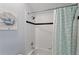 Full bathroom showing a tiled shower and bathtub with a shower curtain at 558 Cadiz Loop, Davenport, FL 33837