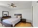 Comfortable bedroom with wood floors, modern furniture, and a ceiling fan at 558 Cadiz Loop, Davenport, FL 33837