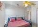 Bedroom features a cozy daybed with bright natural light and a ceiling fan at 558 Cadiz Loop, Davenport, FL 33837