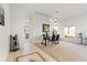 Dining room featuring new carpet, a modern light fixture, and a bright window at 558 Cadiz Loop, Davenport, FL 33837