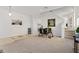 Open-concept dining area with modern decor, ample natural light, and neutral carpet at 558 Cadiz Loop, Davenport, FL 33837