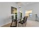 Cozy dining area with modern table, plants, and staircase nearby at 558 Cadiz Loop, Davenport, FL 33837