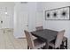 Dining area featuring modern decor, tile floors, and easy access to other living areas at 558 Cadiz Loop, Davenport, FL 33837