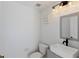 A half-bathroom featuring a modern vessel sink, stylish mirror, and decorative lighting at 558 Cadiz Loop, Davenport, FL 33837