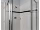 Modern tiled shower with glass doors and stylish fixtures at 558 Cadiz Loop, Davenport, FL 33837