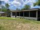 View of the back of the home with a screened in patio at 5918 Stratton Ln, Orlando, FL 32808
