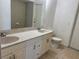 Bathroom featuring double sinks with a tile floor and a toilet at 5918 Stratton Ln, Orlando, FL 32808