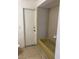 Bathroom featuring a tile shower and a door to the outside at 5918 Stratton Ln, Orlando, FL 32808