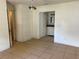 Room adjacent to a bathroom featuring tile floors, a light fixture, and access to a bathroom with a vanity at 5918 Stratton Ln, Orlando, FL 32808