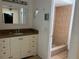 Bathroom featuring a single sink vanity with stone countertop and a glass enclosed shower at 5918 Stratton Ln, Orlando, FL 32808