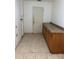 Laundry room featuring a long countertop and tile floors at 5918 Stratton Ln, Orlando, FL 32808