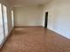 Spacious living room with tile floors and natural light streaming through large windows with blinds at 5918 Stratton Ln, Orlando, FL 32808