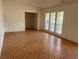 Bright living room featuring tile floors, multiple windows, and an open layout leading to other rooms at 5918 Stratton Ln, Orlando, FL 32808