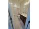 Bathroom featuring vanity with dark wood cabinets, a large mirror, and a shower-tub combo at 6129 Citrus Grove Ct, St Cloud, FL 34771
