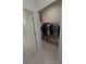 Walk-in closet with clothing rack, shelves, and tile flooring at 6129 Citrus Grove Ct, St Cloud, FL 34771