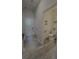 Hallway leading to the laundry room and half bathroom with wood flooring at 6129 Citrus Grove Ct, St Cloud, FL 34771