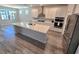 Well-lit kitchen with a spacious island, stainless steel appliances, and a sleek design at 6129 Citrus Grove Ct, St Cloud, FL 34771