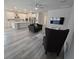 Open-concept living room and kitchen, featuring modern finishes, recessed lighting, and wood-look flooring at 6129 Citrus Grove Ct, St Cloud, FL 34771