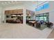 Spacious lobby featuring tile flooring, comfortable seating, and an open layout with views into the dining area at 6129 Citrus Grove Ct, St Cloud, FL 34771