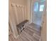 Cozy mudroom with a built-in bench, shoe storage, and convenient hooks for hanging items at 6129 Citrus Grove Ct, St Cloud, FL 34771