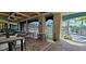 Charming outdoor dining area with patio seating and views of the pool and surrounding landscape at 6129 Citrus Grove Ct, St Cloud, FL 34771