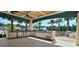 Covered outdoor kitchen with grill and sink for entertaining at 6129 Citrus Grove Ct, St Cloud, FL 34771