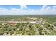 An aerial view of the property in a neighborhood setting on a clear day under a blue sky with fluffy clouds at 619 Byron Rd, Winter Park, FL 32792