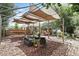 Shaded backyard featuring comfortable seating and a relaxing hammock area under a canopy at 619 Byron Rd, Winter Park, FL 32792