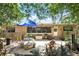 Backyard patio with a stone table and bamboo trees at 619 Byron Rd, Winter Park, FL 32792
