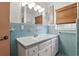 A classic bathroom with a tiled sink and vanity area at 619 Byron Rd, Winter Park, FL 32792