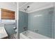 This is a tiled bathroom with a combined tub and shower at 619 Byron Rd, Winter Park, FL 32792