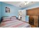Comfortable bedroom features hardwood floors, a desk, and a bright atmosphere at 619 Byron Rd, Winter Park, FL 32792