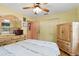 Bright bedroom with a comfortable bed, dresser, and closet at 619 Byron Rd, Winter Park, FL 32792