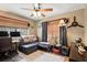 Bedroom featuring a ceiling fan, a window with blinds, and a comfortable seating area at 619 Byron Rd, Winter Park, FL 32792