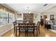 Elegant dining room with a wooden table and chairs, featuring a china cabinet and large windows for natural light at 619 Byron Rd, Winter Park, FL 32792