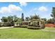 Charming single-story home with a well-manicured lawn nestled in a green, lush setting at 619 Byron Rd, Winter Park, FL 32792