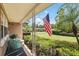 Charming front porch with two blue chairs and green landscaping at 619 Byron Rd, Winter Park, FL 32792