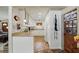 Well-lit kitchen featuring white cabinets and ample counter space, providing a clean and functional cooking area at 619 Byron Rd, Winter Park, FL 32792