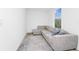 Cozy bedroom featuring plush sectional, natural light, and neutral color scheme at 652 Benoi Dr, Davenport, FL 33896