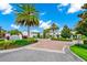 Welcoming entrance to The Enclaves Amenity Center, showcasing lush landscaping and well-maintained buildings at 652 Benoi Dr, Davenport, FL 33896