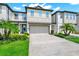 Charming two-story townhouse with attached two-car garage and well-manicured landscaping at 652 Benoi Dr, Davenport, FL 33896