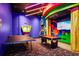 An entertainment space includes a ping pong and billiards for hours of fun at 652 Benoi Dr, Davenport, FL 33896