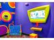 Bright, colorful game room with electronic games, connect four game, and vibrant wall decor at 652 Benoi Dr, Davenport, FL 33896